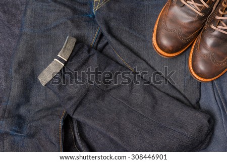 Raw denim jeans selvedge, japan raw denim jeans, dark blue jean texture with leather boots