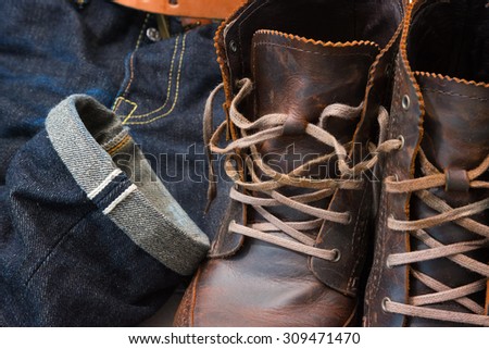 Raw denim jeans selvedge, japan raw denim jeans, dark blue jean texture with leather boots