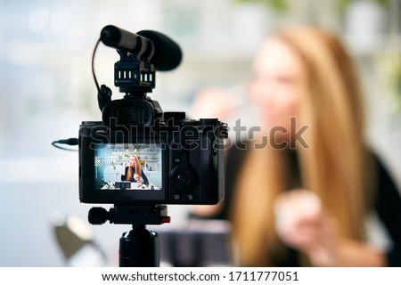 Image, Stock Photo Woman recording video blog with camera