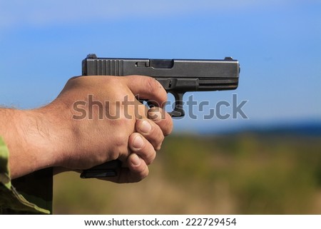 gun held in both hands