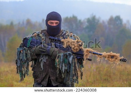sniper with camouflage clothing