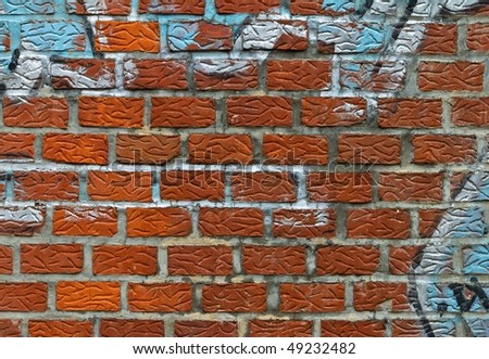 spray painted brick wall