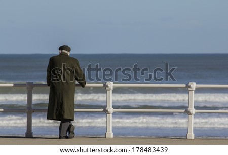 Old man with coat and hat