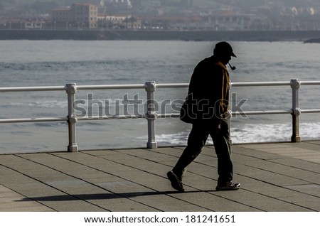 Old man walking around town