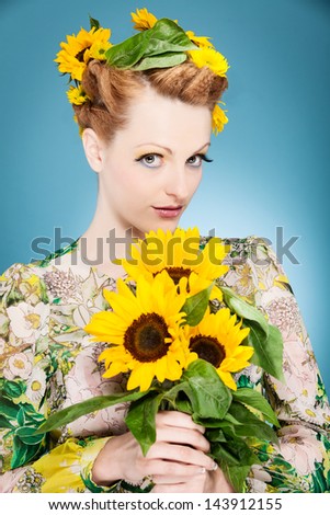 Photo of fresh summer makeup with sunflowers in the head