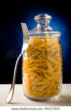 photo of a glass container with raw pasta inside