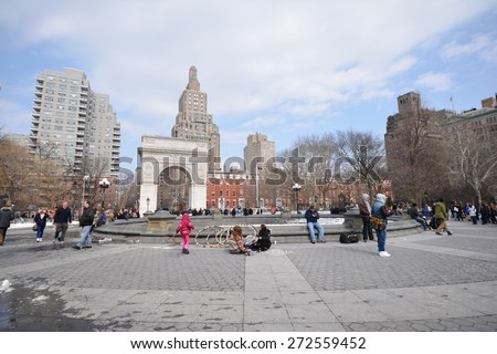 NEW YORK CITY - MARCH 8th 2015: people walk in the Washington Square Park on the weekend, Manhattan USA