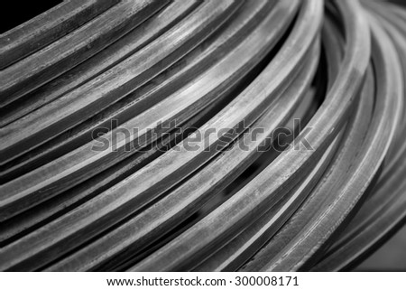 Close up metallic wire coil for industrial background in black and white color