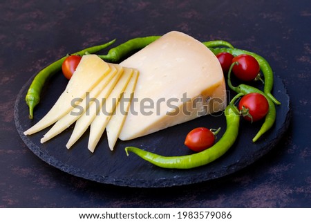 Kashar cheese or kashkaval cheese. Sliced Cheddar Cheese. gourmet cheese. local name trakya kaşar peyniri