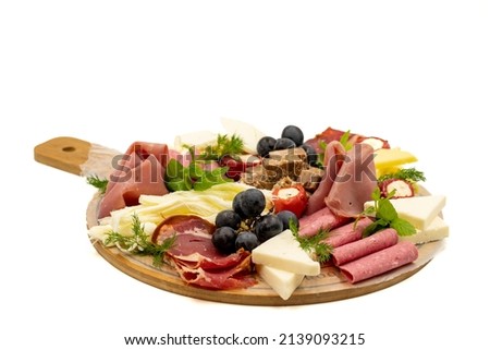 Cold Smoked Meat Plate, antipasto set platter wooden plate. Antipasto board with sliced meat, ham, salami, cheese Foto stock © 