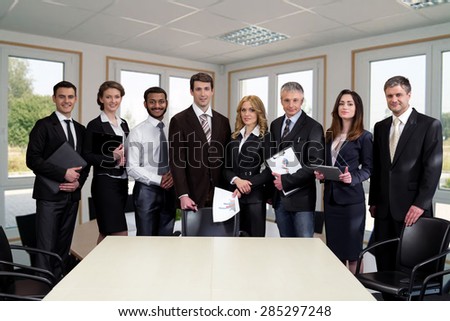 Business people in modern light office. Successful managers.