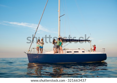 Young people is resting on a sailing yacht at sea. Weekend on a yacht. Yachting. Cruise on a yacht on the ocean. Guys and girls are traveling on a yacht. Youth party on a yacht.