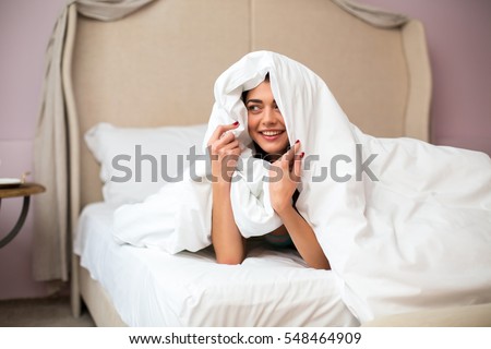 Similar – Image, Stock Photo Positive lady hiding under blanket at home