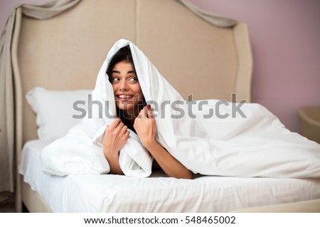 Similar – Image, Stock Photo Positive lady hiding under blanket at home