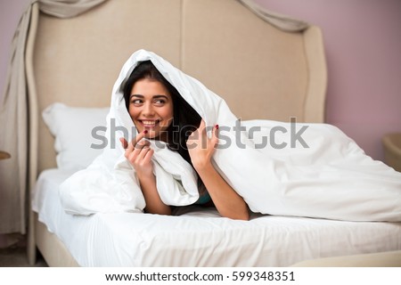 Similar – Image, Stock Photo Positive lady hiding under blanket at home