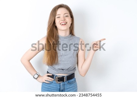 Similar – Image, Stock Photo This way. Shows a girl in a bathing cap, with her hand outstretched by the sea in one direction.