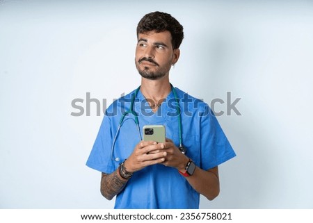 Similar – Image, Stock Photo young veterinarian man reading documents about illness of a cute small dog.on white background. Indoors