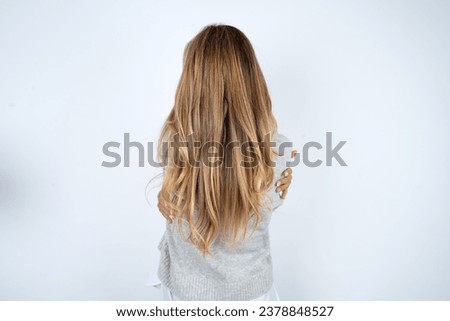 Similar – Image, Stock Photo Rear view blonde woman walking in the evening on field, low sun