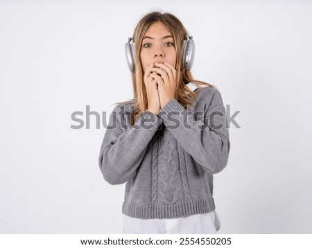 Similar – Image, Stock Photo Beautiful teenage girl opens a gift made of kraft paper tied with a red ribbon, new year mood. Holiday concept of Christmas and New Year at home.