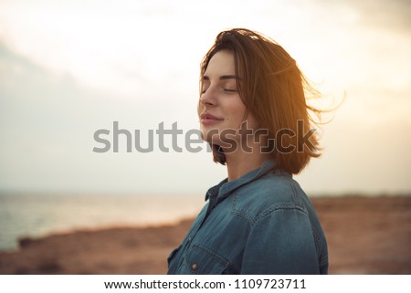 Similar – Foto Bild Frau genießt den Sonnenuntergang an einem schönen Strand.