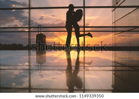 Similar – Image, Stock Photo Delighted couple hugging during sunset in nature