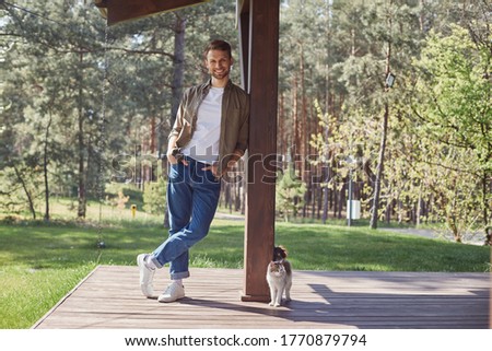 Similar – Image, Stock Photo Man leaning on wooden door