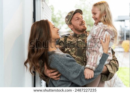 Image, Stock Photo Girl hugging military man after homecoming