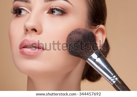 Similar – Image, Stock Photo Professional visagiste applying powder on model face