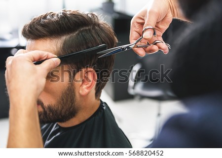 Similar – Image, Stock Photo Hands of a barber washing the head with shampoo to a client with the head resting on the sink