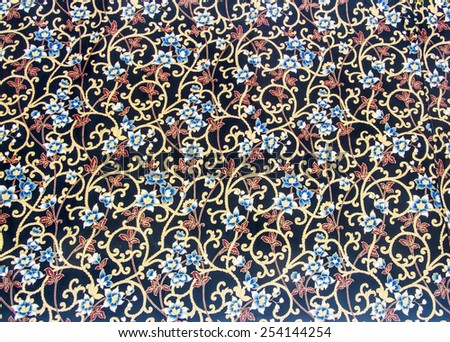 Vine with white blue flower and red leaf pattern.  Batik texture pattern in thai style