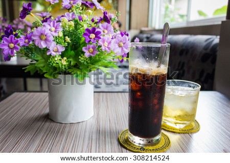 Ice black coffee and tea cup  on the table
