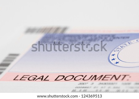 A State Legal Document envelope, with shallow depth of field.