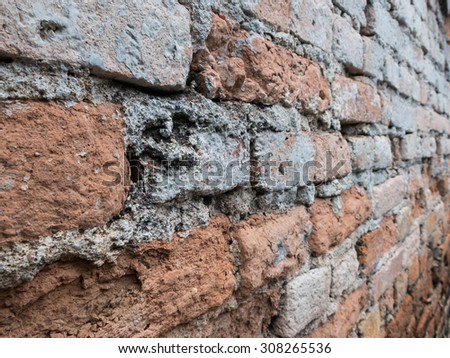 Bricks wall texture background gray and orange soft focus