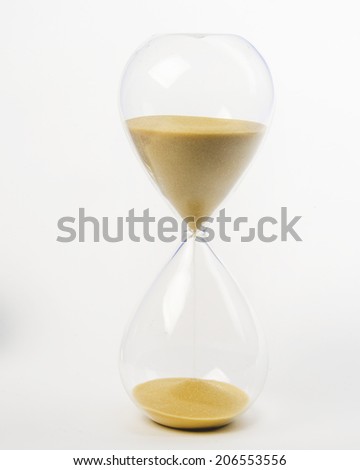 Sand Streams in a hour glass/Hour Glass/Vintage hand blown hour glass with sand streaming marking time