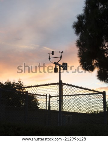 Evening clouds behind a weather station/Metrology Measurements/Evening clouds at a local weather recording station