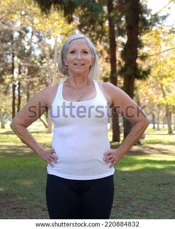 Healthy older woman in park setting/Health Senior Woman/Mature woman exhibits health