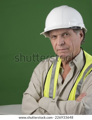 Optimistic looking senior construction man/Serious Construction Worker/Senior man with hard hat with positive attitude