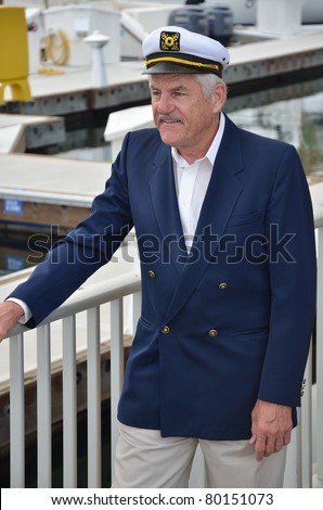 Mature man wearing captain hat/Seaman Captain/Portrait of a gentleman wearing a captain hat