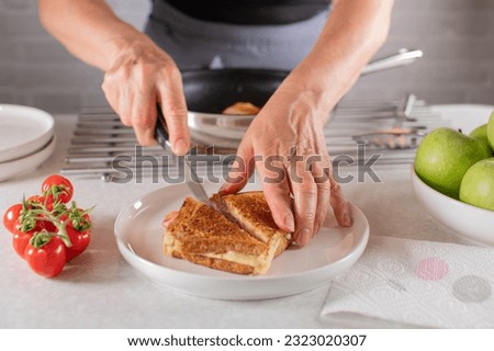 Similar – Image, Stock Photo Hand mit frischen halbierten Orangen auf einem Holzschneidebrett auf einem schwarzen Hintergrund