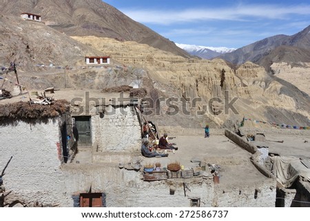 Ladakh, India -  18 April 2014 : People on the roof top of Lamayuru monastery in Ladakh, India.