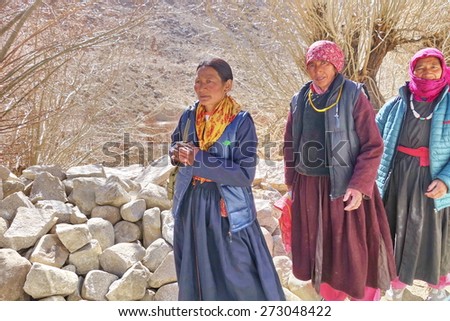 LADAKH, INDIA - 15 APRIL 2014: Ladakhi women in traditional costume on the road in Ladakh, Jammu and Kashmir State, North India.