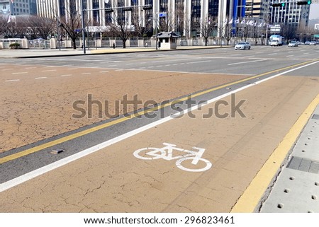 SEOUL, KOREA - MARCH 23, 2015 : Bicycle lane on the street of Seoul on March 23. South Korea is taking measures against global warming  by constructing more bicycle-only lanes throughout the city.