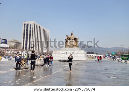 SEOUL, SOUTH KOREA - MARCH 25, 2015 : People in front of statue of King Sejong in Gwanghwamun Square. This area is a public open space on Sejongno, Jongno-gu in Seoul, South Korea.