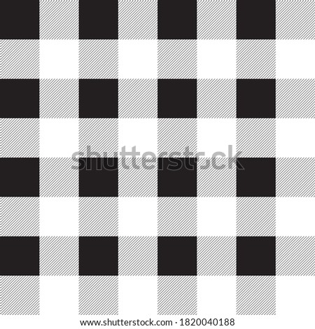 Plaid check patten in black and white. Seamless fabric texture background.