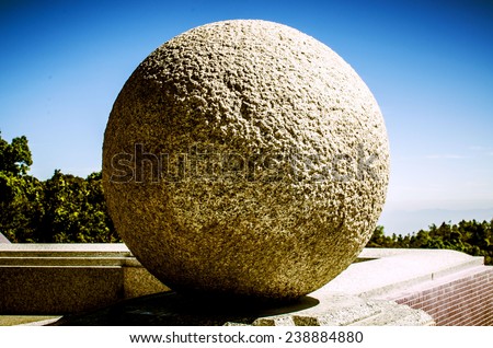 Close up of rolling stone. Outdoor, Thailand / Rolling stone, Zen stone / Zen stone, Rolling stone background blue sky (stone, ball, zen)
