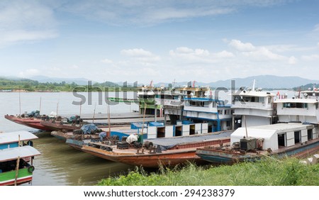 CHIANG RAI, THAILAND - JULY 5,2015 - Golden triangle in Thailand .The Golden Triangle designates the confluence of the Ruak River and the Mekong River,transportation chinese ship parking on the dock