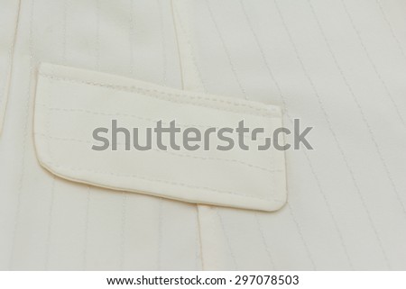 Pocket on ivory-color suit