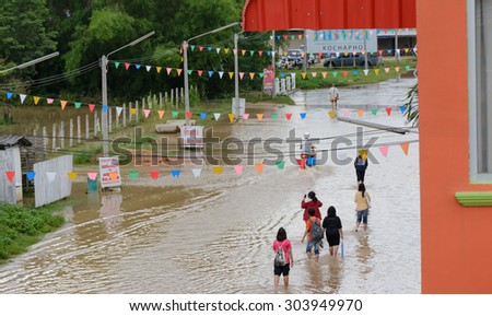 CHIANGRAI,THAILAND : AUGUST 6 - Flash flood immediately cover the road with water,with one side of the road completely submerged on August 6,2015 at Mae Fah Luang district,Chiang rai Thailand .
