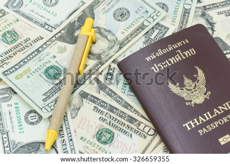 us dollar banknote with Thailand passport and pen ,travel abroad must be prepare