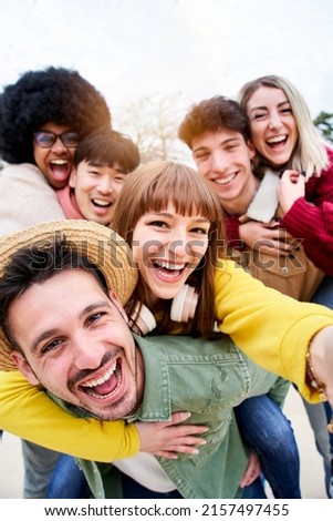 Similar – Image, Stock Photo Cheerful ethnic couple taking selfie in park